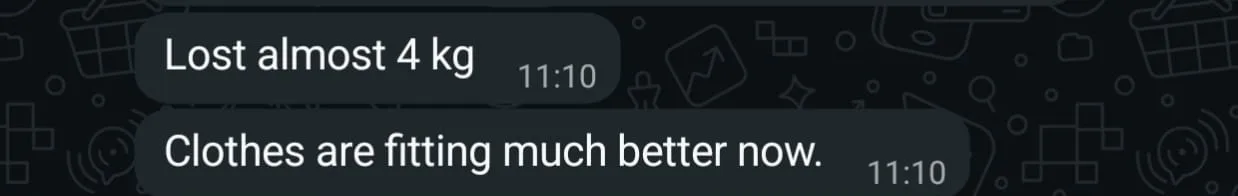 WhatsApp check-in from a client reporting almost 4 kg lost and clothes fitting much better