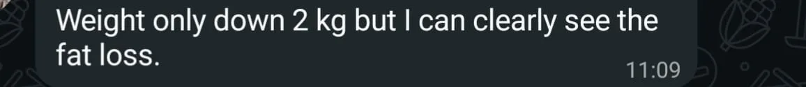 WhatsApp check-in from a client reporting 2 kg down with clearly visible fat loss