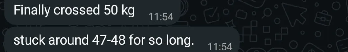 WhatsApp check-in from a client reporting she finally crossed 50 kg after being stuck around 47 to 48 kg